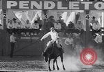 Image of cowboys at rodeo Pendleton Oregon USA, 1953, second 18 stock footage video 65675040164