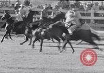 Image of cowboys at rodeo Pendleton Oregon USA, 1953, second 25 stock footage video 65675040164