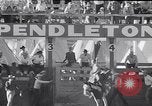 Image of cowboys at rodeo Pendleton Oregon USA, 1953, second 27 stock footage video 65675040164