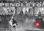 Image of cowboys at rodeo Pendleton Oregon USA, 1953, second 29 stock footage video 65675040164