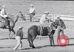 Image of cowboys at rodeo Pendleton Oregon USA, 1953, second 33 stock footage video 65675040164