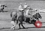 Image of cowboys at rodeo Pendleton Oregon USA, 1953, second 34 stock footage video 65675040164