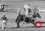 Image of cowboys at rodeo Pendleton Oregon USA, 1953, second 35 stock footage video 65675040164