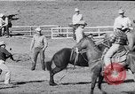 Image of cowboys at rodeo Pendleton Oregon USA, 1953, second 37 stock footage video 65675040164