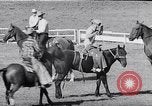 Image of cowboys at rodeo Pendleton Oregon USA, 1953, second 45 stock footage video 65675040164