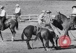 Image of cowboys at rodeo Pendleton Oregon USA, 1953, second 46 stock footage video 65675040164