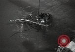Image of Soviet soldiers use cables to recover German aircraft wreckage from a river Soviet Union, 1941, second 22 stock footage video 65675040198