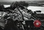 Image of Soviet soldiers use cables to recover German aircraft wreckage from a river Soviet Union, 1941, second 46 stock footage video 65675040198
