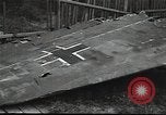 Image of Soviet soldiers use cables to recover German aircraft wreckage from a river Soviet Union, 1941, second 54 stock footage video 65675040198