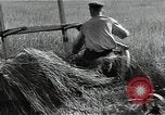Image of Soviet farmers harvest wheat during World War 2 Soviet Union, 1941, second 20 stock footage video 65675040210