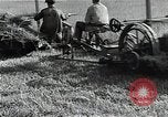 Image of Soviet farmers harvest wheat during World War 2 Soviet Union, 1941, second 25 stock footage video 65675040210