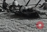 Image of Soviet farmers harvest wheat during World War 2 Soviet Union, 1941, second 26 stock footage video 65675040210