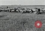 Image of Soviet farmers harvest wheat during World War 2 Soviet Union, 1941, second 30 stock footage video 65675040210