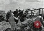 Image of Soviet farmers harvest wheat during World War 2 Soviet Union, 1941, second 35 stock footage video 65675040210