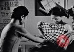 Standbild Verwestlichung Chinas zeigt Frauen shopping und arbeiten China, 1937, aus Sekunde 36 historischem Filmmaterial Videoclip 65675040305