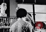 Standbild Verwestlichung Chinas zeigt Frauen shopping und arbeiten China, 1937, aus Sekunde 49 historischem Filmmaterial Videoclip 65675040305