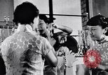 Standbild Verwestlichung Chinas zeigt Frauen shopping und arbeiten China, 1937, aus Sekunde 53 historischem Filmmaterial Videoclip 65675040305