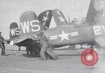 Image of F4U airplanes being moved on USS Badoeng Strait (CVE – 116) Pacific Ocean, 1950, second 1 stock footage video 65675040316
