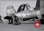 Image of F4U airplanes being moved on USS Badoeng Strait (CVE – 116) Pacific Ocean, 1950, second 3 stock footage video 65675040316
