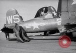 Image of F4U airplanes being moved on USS Badoeng Strait (CVE – 116) Pacific Ocean, 1950, second 6 stock footage video 65675040316