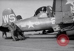 Image of F4U airplanes being moved on USS Badoeng Strait (CVE – 116) Pacific Ocean, 1950, second 7 stock footage video 65675040316