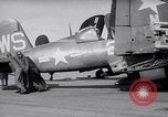 Image of F4U airplanes being moved on USS Badoeng Strait (CVE – 116) Pacific Ocean, 1950, second 8 stock footage video 65675040316