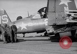 Image of F4U airplanes being moved on USS Badoeng Strait (CVE – 116) Pacific Ocean, 1950, second 9 stock footage video 65675040316