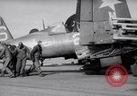 Image of F4U airplanes being moved on USS Badoeng Strait (CVE – 116) Pacific Ocean, 1950, second 10 stock footage video 65675040316