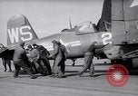 Image of F4U airplanes being moved on USS Badoeng Strait (CVE – 116) Pacific Ocean, 1950, second 11 stock footage video 65675040316