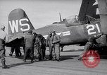 Image of F4U airplanes being moved on USS Badoeng Strait (CVE – 116) Pacific Ocean, 1950, second 13 stock footage video 65675040316