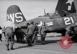 Image of F4U airplanes being moved on USS Badoeng Strait (CVE – 116) Pacific Ocean, 1950, second 14 stock footage video 65675040316