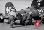 Image of F4U airplanes being moved on USS Badoeng Strait (CVE – 116) Pacific Ocean, 1950, second 15 stock footage video 65675040316