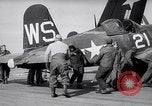 Image of F4U airplanes being moved on USS Badoeng Strait (CVE – 116) Pacific Ocean, 1950, second 16 stock footage video 65675040316