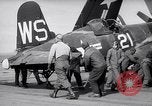 Image of F4U airplanes being moved on USS Badoeng Strait (CVE – 116) Pacific Ocean, 1950, second 17 stock footage video 65675040316
