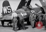Image of F4U airplanes being moved on USS Badoeng Strait (CVE – 116) Pacific Ocean, 1950, second 18 stock footage video 65675040316