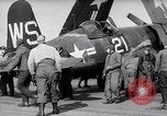 Image of F4U airplanes being moved on USS Badoeng Strait (CVE – 116) Pacific Ocean, 1950, second 19 stock footage video 65675040316