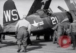 Image of F4U airplanes being moved on USS Badoeng Strait (CVE – 116) Pacific Ocean, 1950, second 20 stock footage video 65675040316