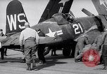 Image of F4U airplanes being moved on USS Badoeng Strait (CVE – 116) Pacific Ocean, 1950, second 21 stock footage video 65675040316