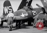 Image of F4U airplanes being moved on USS Badoeng Strait (CVE – 116) Pacific Ocean, 1950, second 22 stock footage video 65675040316
