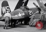 Image of F4U airplanes being moved on USS Badoeng Strait (CVE – 116) Pacific Ocean, 1950, second 24 stock footage video 65675040316
