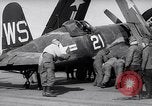 Image of F4U airplanes being moved on USS Badoeng Strait (CVE – 116) Pacific Ocean, 1950, second 25 stock footage video 65675040316