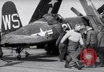Image of F4U airplanes being moved on USS Badoeng Strait (CVE – 116) Pacific Ocean, 1950, second 27 stock footage video 65675040316