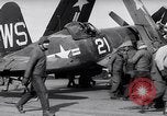 Image of F4U airplanes being moved on USS Badoeng Strait (CVE – 116) Pacific Ocean, 1950, second 28 stock footage video 65675040316