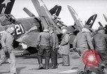 Image of F4U airplanes being moved on USS Badoeng Strait (CVE – 116) Pacific Ocean, 1950, second 29 stock footage video 65675040316