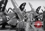 Image of F4U airplanes being moved on USS Badoeng Strait (CVE – 116) Pacific Ocean, 1950, second 31 stock footage video 65675040316