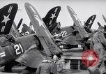 Image of F4U airplanes being moved on USS Badoeng Strait (CVE – 116) Pacific Ocean, 1950, second 32 stock footage video 65675040316