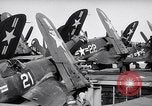 Image of F4U airplanes being moved on USS Badoeng Strait (CVE – 116) Pacific Ocean, 1950, second 33 stock footage video 65675040316