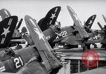 Image of F4U airplanes being moved on USS Badoeng Strait (CVE – 116) Pacific Ocean, 1950, second 34 stock footage video 65675040316