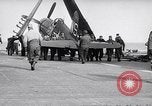 Image of F4U airplanes being moved on USS Badoeng Strait (CVE – 116) Pacific Ocean, 1950, second 36 stock footage video 65675040316