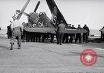 Image of F4U airplanes being moved on USS Badoeng Strait (CVE – 116) Pacific Ocean, 1950, second 37 stock footage video 65675040316